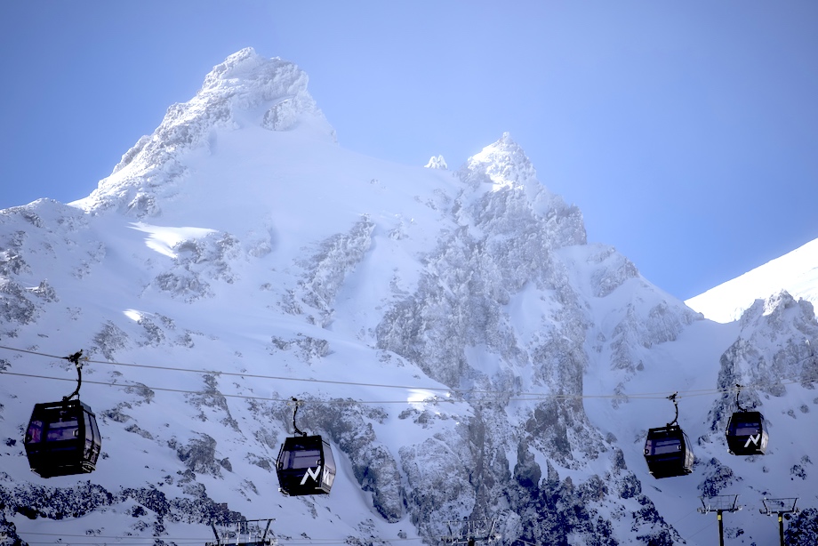 Ski lift carriages ascend up a slope at Mount Ruapehu. 