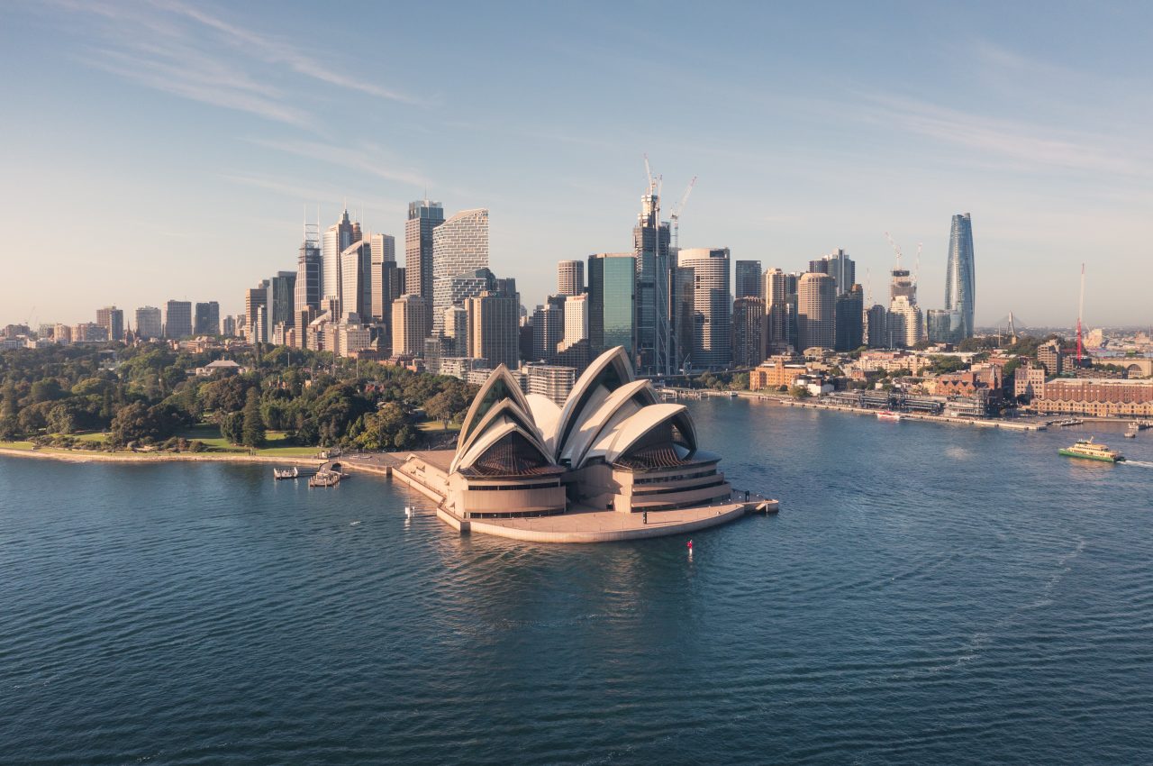 The Sydney Opera House surrounded by Sydney Harbour, the Royal Botanic Garden Sydney, and Sydney CBD