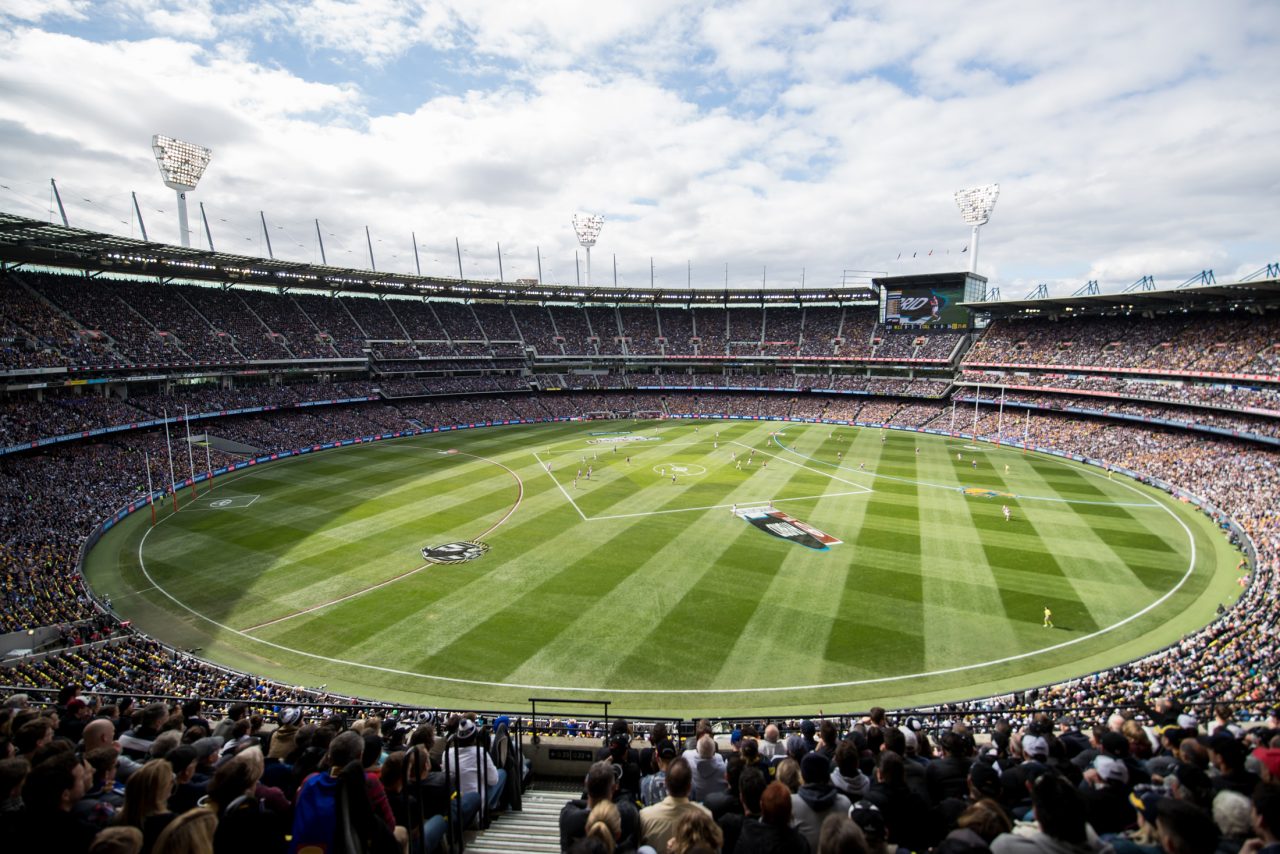 a full stadium packed to watch the AFL grand final play.