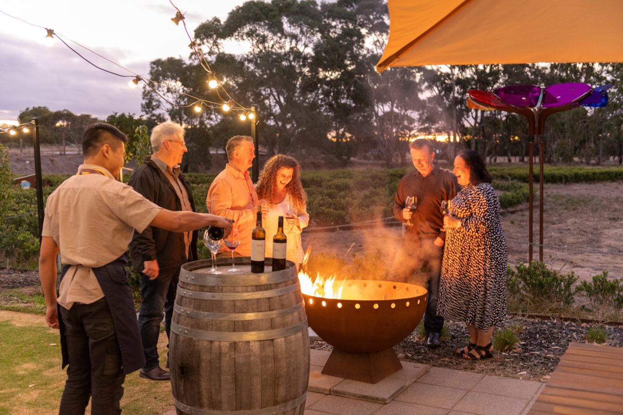 Group of friends enjoying a wine tasting in the Barossa Valley.