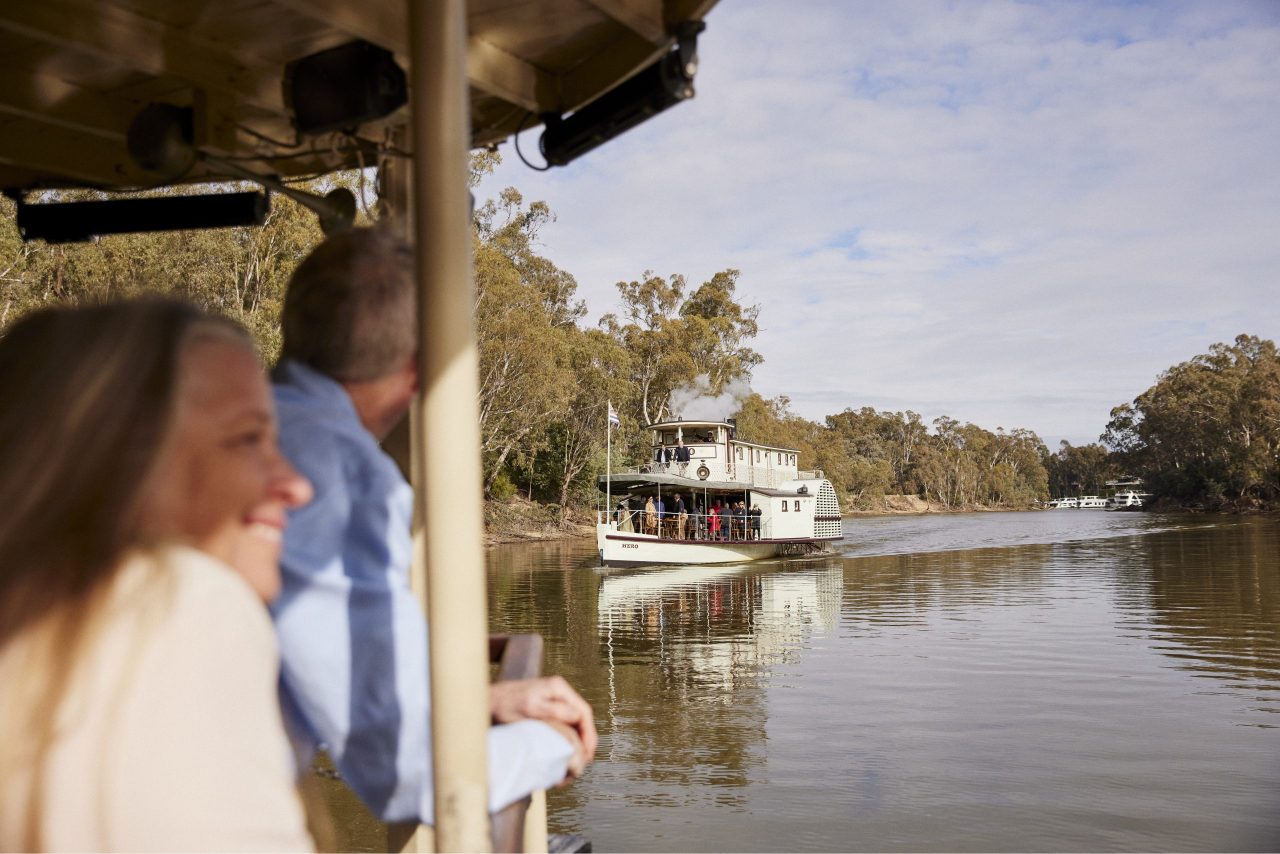Couple enjoying a ride on a paddle steamer along the Murray River