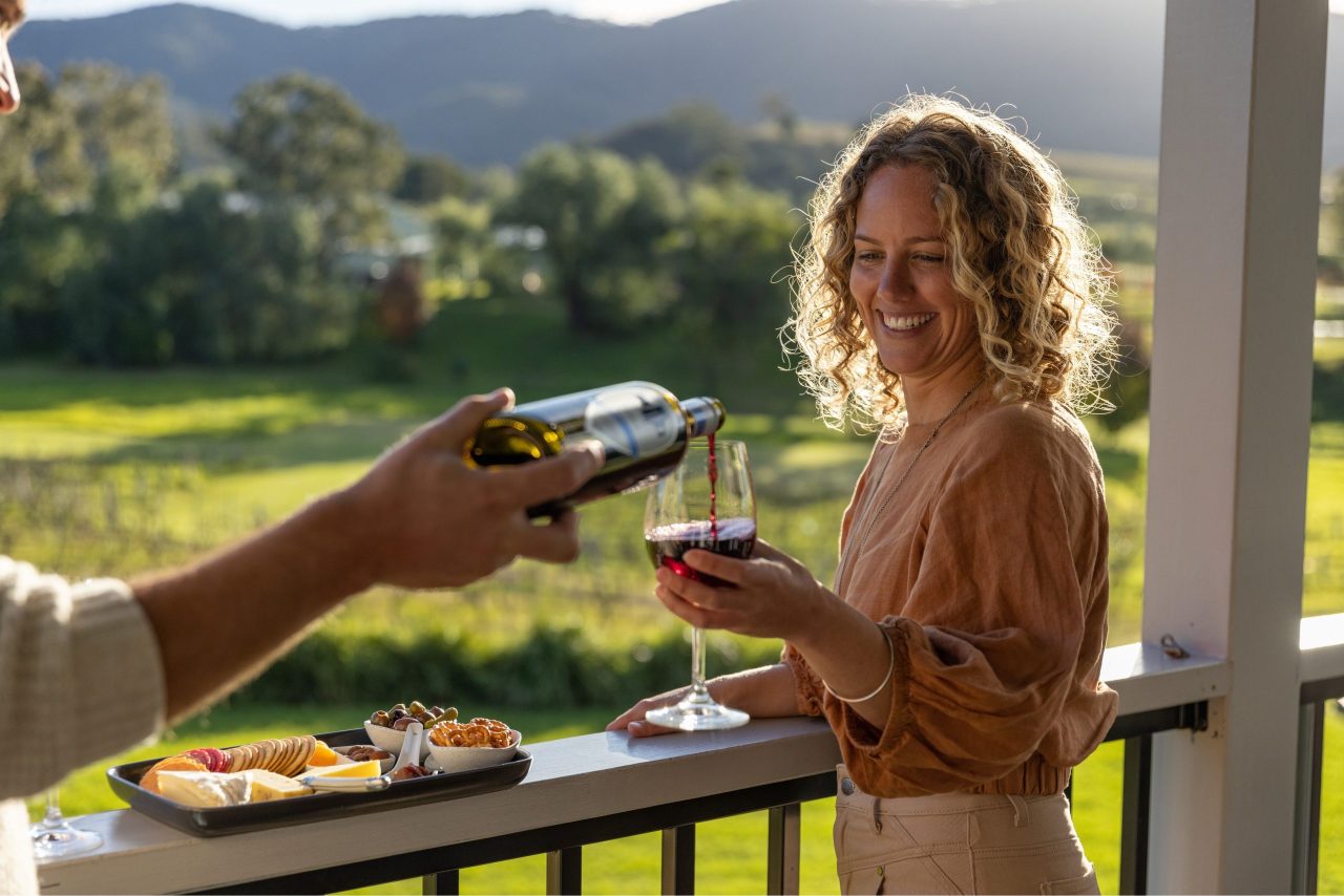 Couple enjoys a glass of wine in the Hunter Valley.
